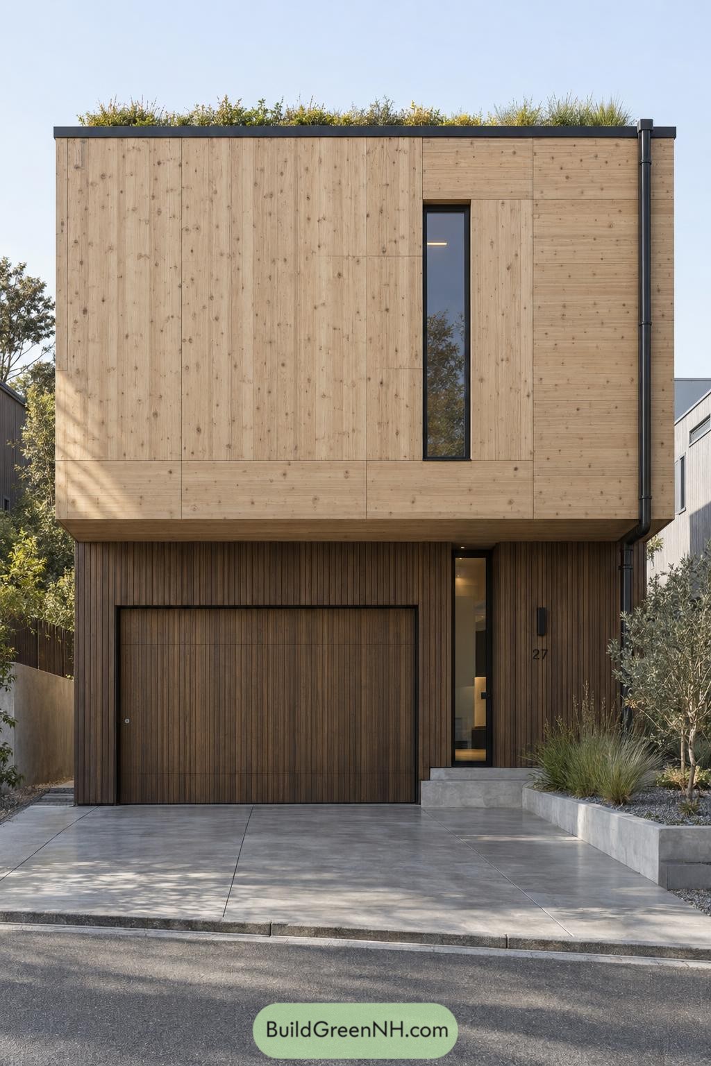Two-story wooden facade with pale upper panels, dark vertical cladding, a concealed garage, and a planted roof